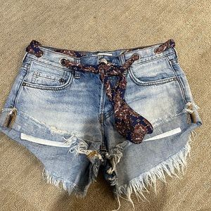 Denim shorts with distressing